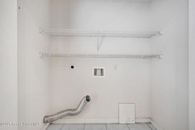 laundry area featuring hookup for a washing machine, hookup for an electric dryer, and light tile patterned flooring