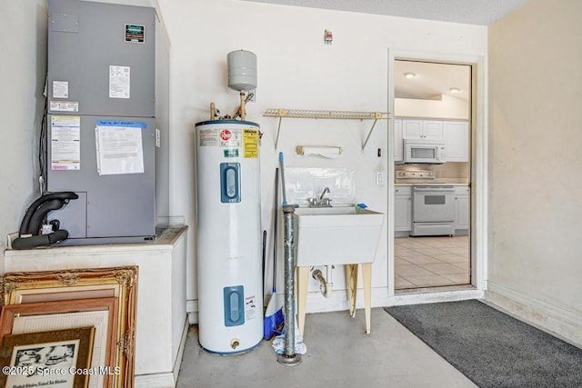 utility room featuring heating unit and electric water heater