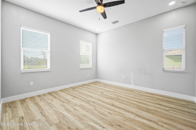 unfurnished room with ceiling fan and light hardwood / wood-style floors