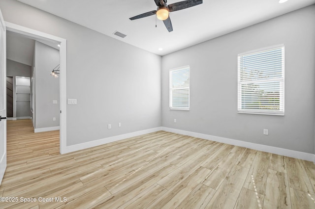 spare room featuring light wood-type flooring and ceiling fan