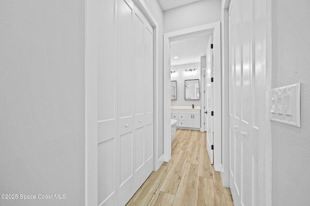 corridor featuring light hardwood / wood-style flooring