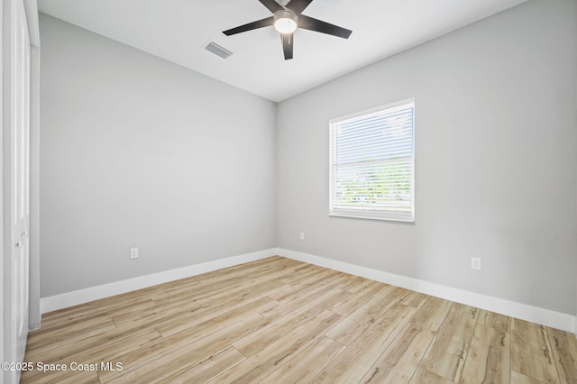 spare room featuring light hardwood / wood-style floors and ceiling fan