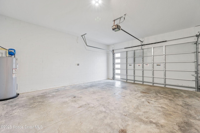 garage featuring electric water heater and a garage door opener