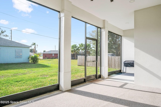 unfurnished sunroom with a wealth of natural light