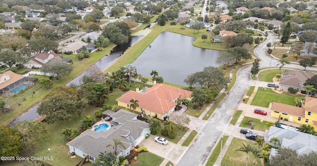 birds eye view of property featuring a water view