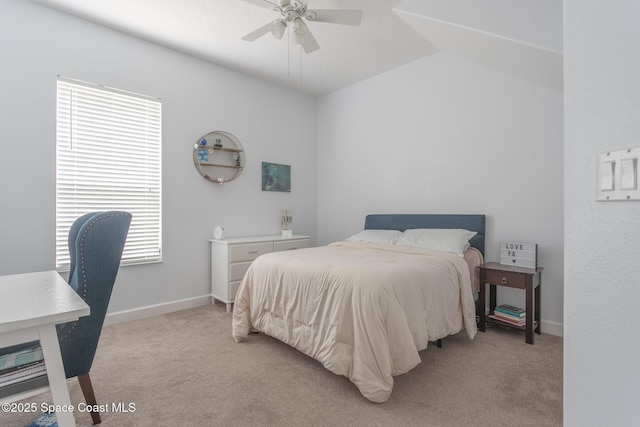 carpeted bedroom featuring vaulted ceiling and ceiling fan