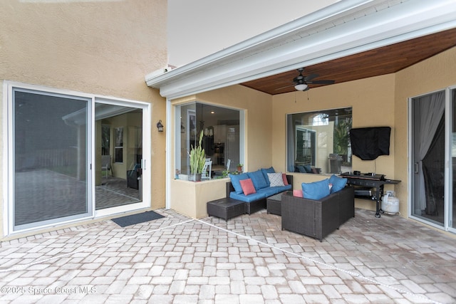 view of patio with ceiling fan and an outdoor hangout area