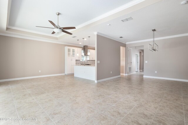 3489 Ahern Pl, Melbourne, FL 32940 - unfurnished living room with ornamental molding, baseboards, a ceiling fan, and visible vents