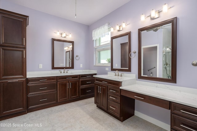 3489 Ahern Pl, Melbourne, FL 32940 - full bath with a shower with door, two vanities, a sink, and ceiling fan