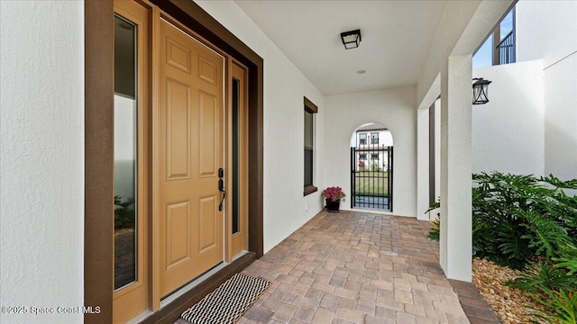 view of exterior entry with stucco siding