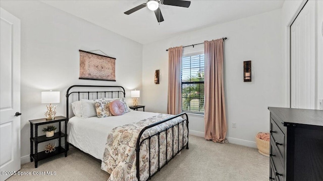 carpeted bedroom featuring ceiling fan