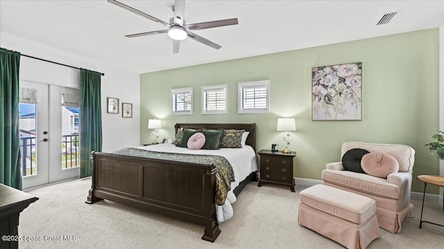 carpeted bedroom featuring access to exterior, ceiling fan, and french doors