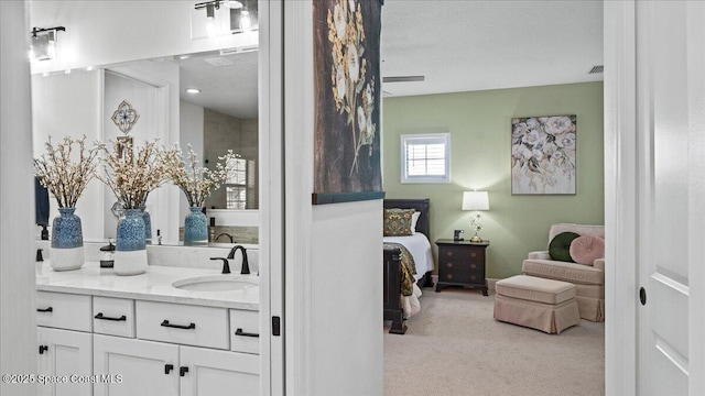 bathroom featuring vanity and a textured ceiling