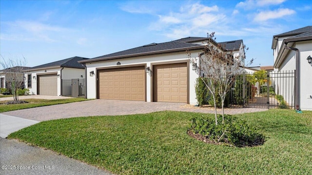 view of side of property featuring a yard and a garage