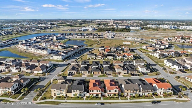 birds eye view of property featuring a water view and a residential view