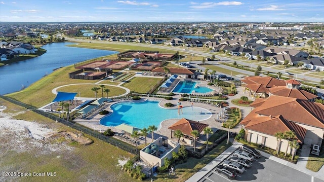 bird's eye view featuring a residential view and a water view