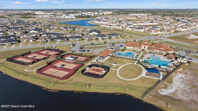 birds eye view of property with a water view and a residential view