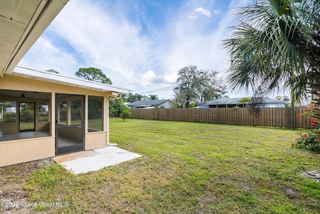 view of yard featuring a sunroom