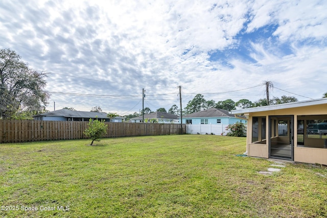 view of yard with a sunroom