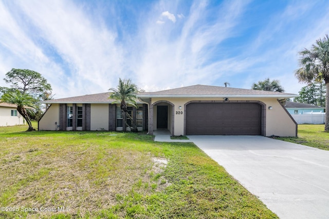 ranch-style house with a garage and a front lawn