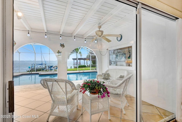 view of pool featuring a water view and ceiling fan