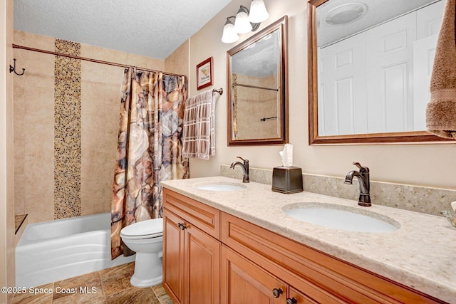 full bathroom with vanity, shower / tub combo with curtain, a textured ceiling, and toilet