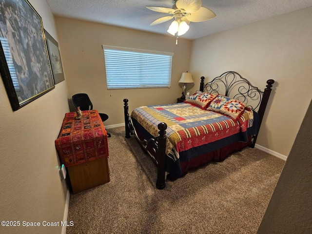 carpeted bedroom featuring ceiling fan and a textured ceiling