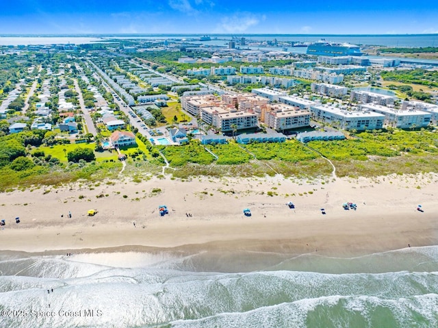 bird's eye view featuring a water view and a view of the beach