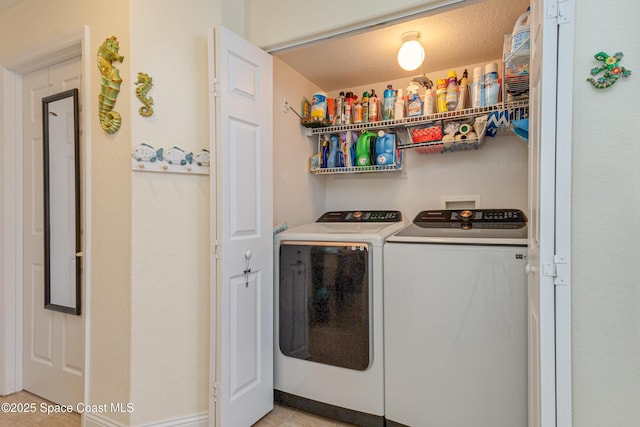 clothes washing area featuring washing machine and dryer