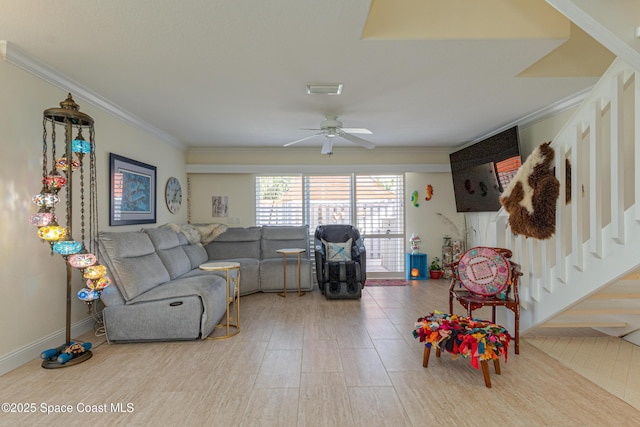 living room featuring ornamental molding and ceiling fan