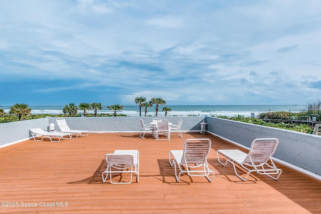 wooden deck featuring a water view