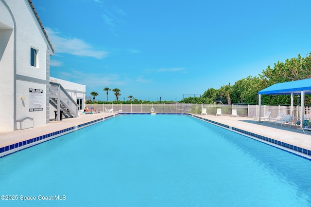 view of swimming pool with a patio area