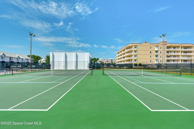 view of tennis court featuring basketball court