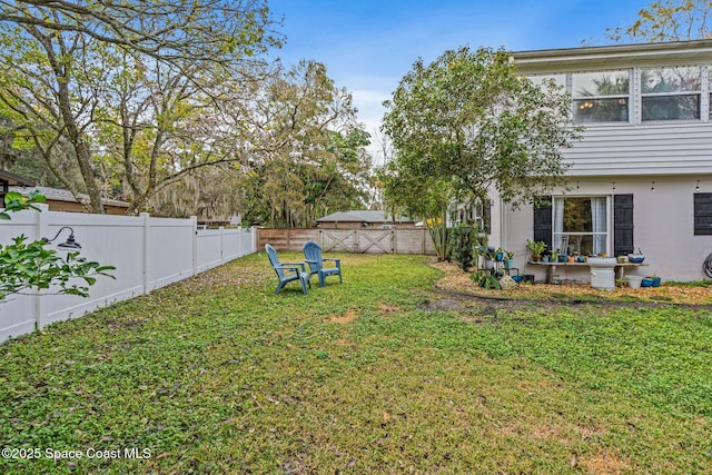 view of yard featuring a fenced backyard