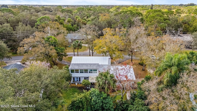 drone / aerial view with a view of trees