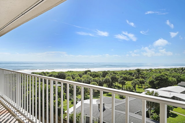 balcony featuring a water view and a view of the beach