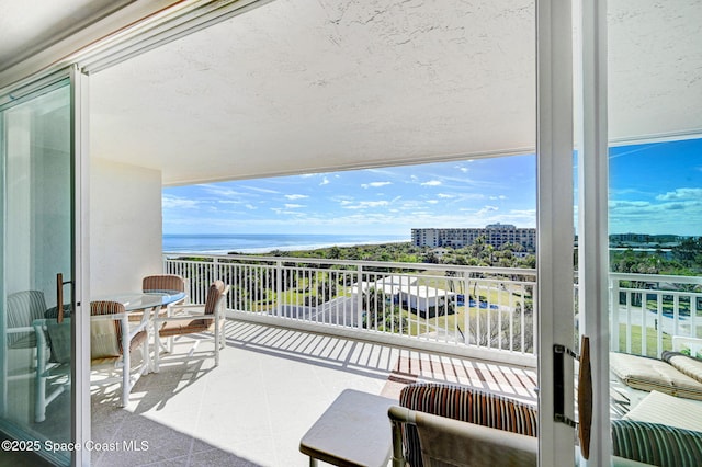 balcony featuring a water view