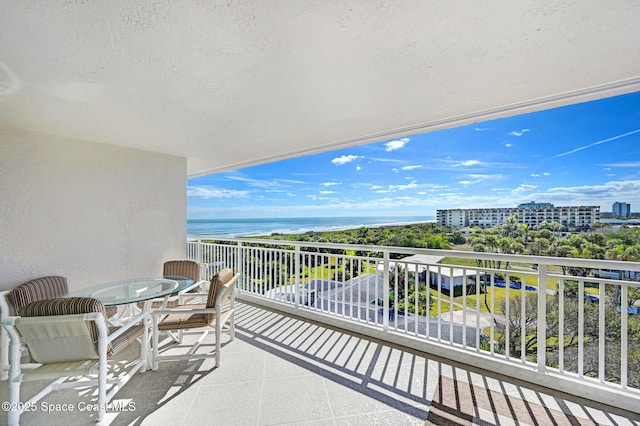 balcony featuring a water view