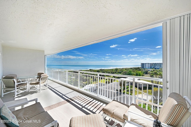 balcony featuring a water view