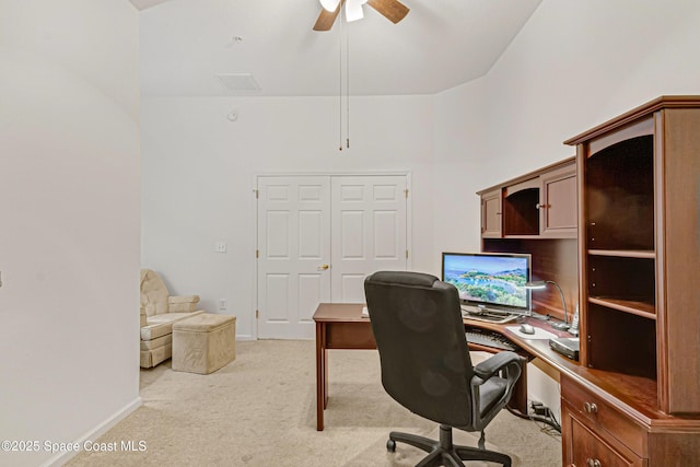 office space with light colored carpet and ceiling fan