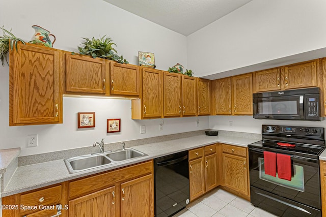 kitchen with lofted ceiling, sink, light tile patterned floors, and black appliances