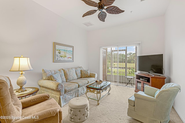 carpeted living room featuring ceiling fan