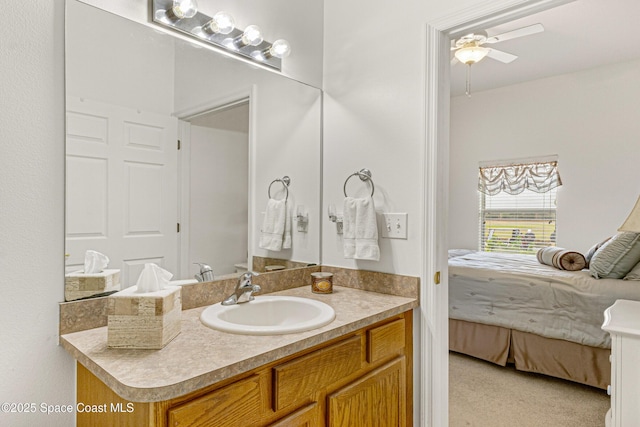 bathroom with ceiling fan and vanity