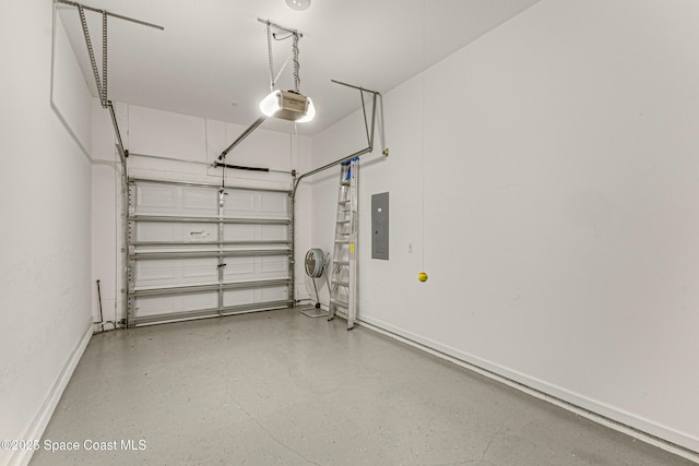 garage with a garage door opener and electric panel