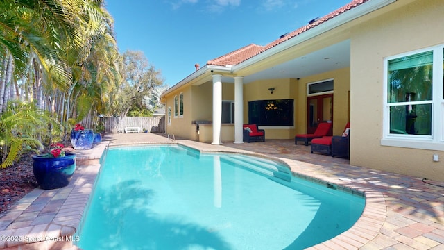 view of pool featuring a patio area