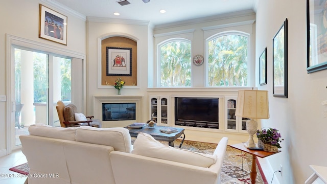 living room featuring tile patterned flooring, crown molding, and a healthy amount of sunlight