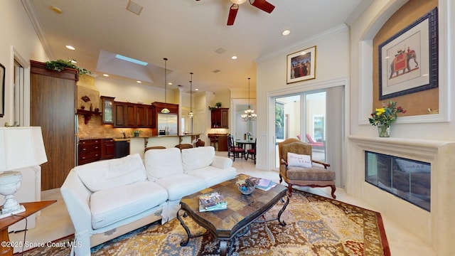 living room with ornamental molding and ceiling fan with notable chandelier