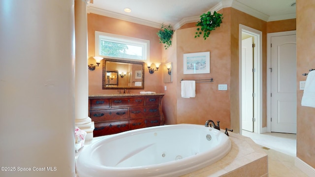 bathroom with vanity, crown molding, and tiled bath