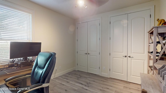 office area with light wood-type flooring