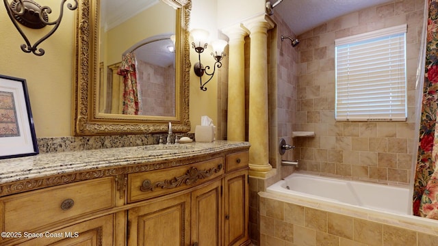 bathroom featuring vanity, shower / tub combo, and a healthy amount of sunlight